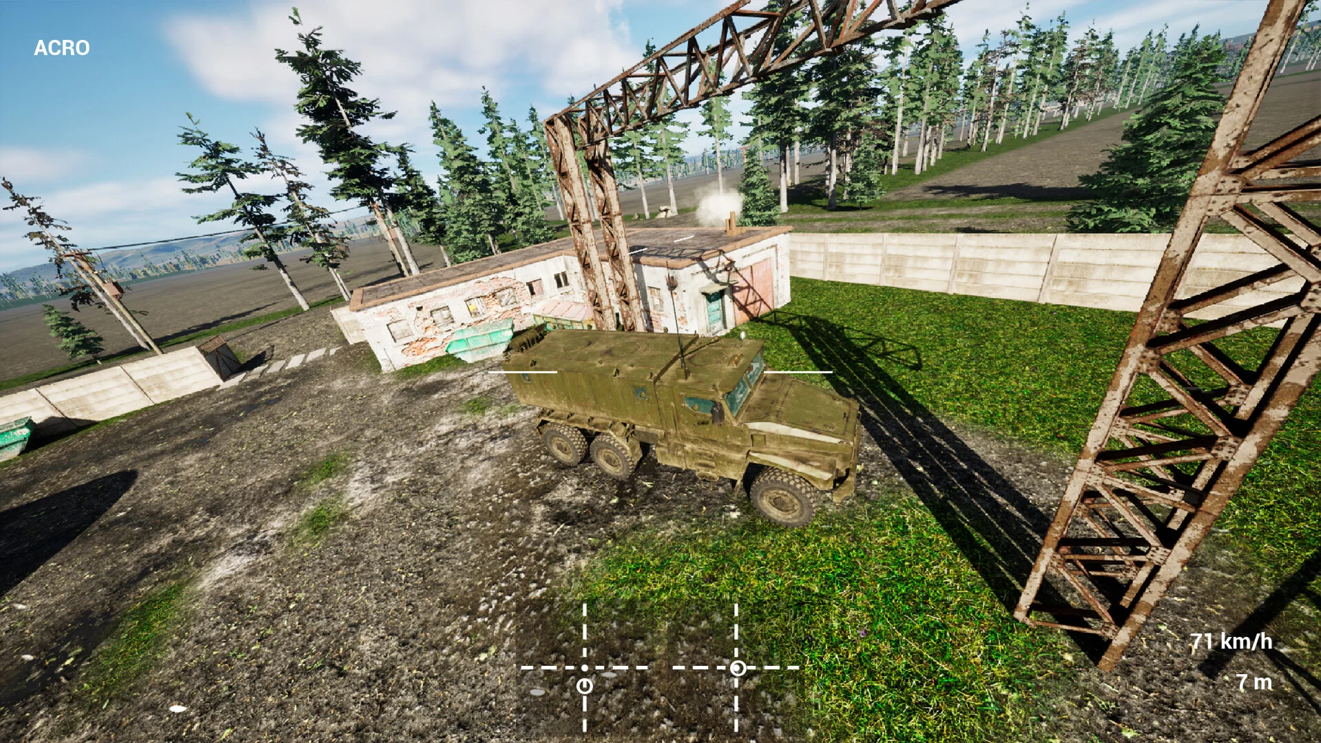 鉄塔と建物のある屋外に停まる緑色の軍用トラックのゲーム画面