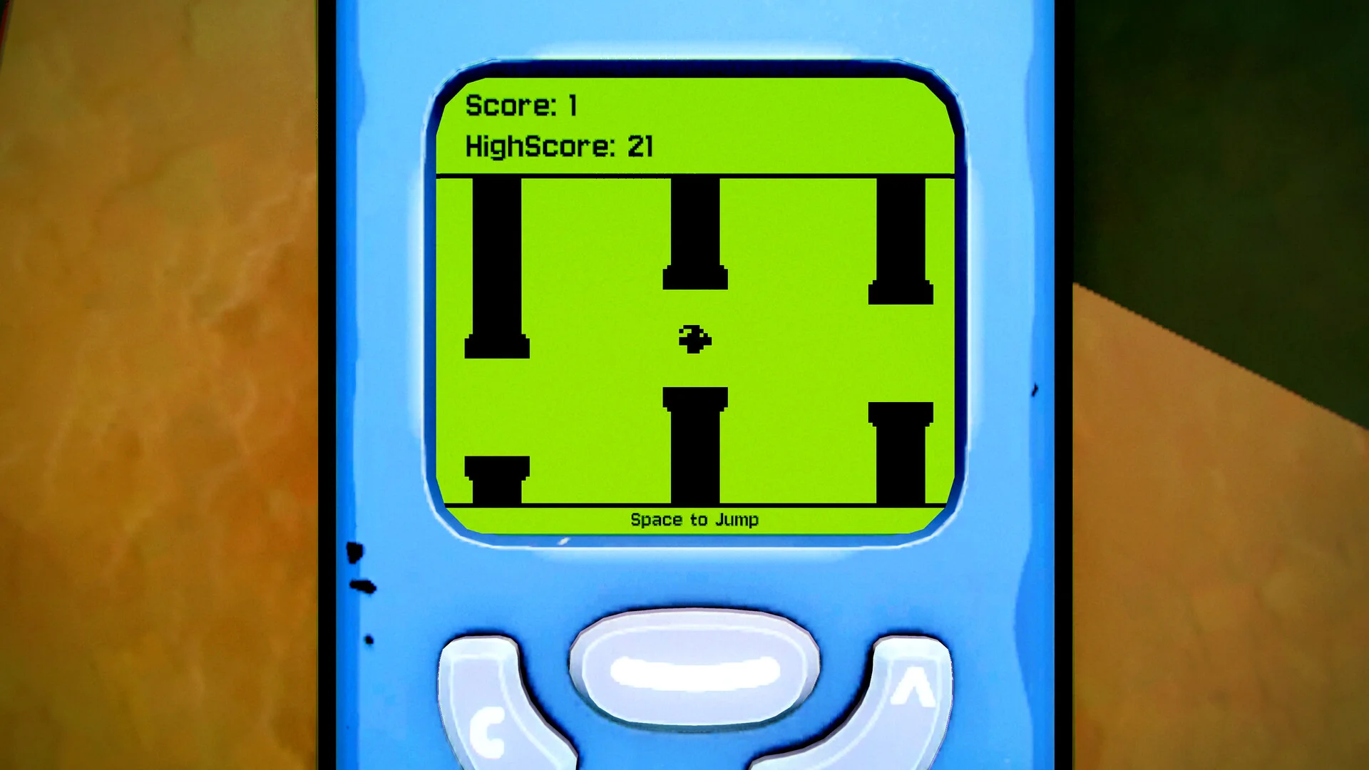 緑の液晶画面のゲーム画面。Score: 1、HighScore: 21、黒い柱の間を鳥が進む