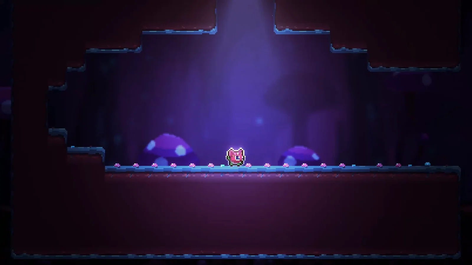 『重力反転された』のゲーム画面。紫の光が差す洞窟に立つピンクの小さなキャラクター
